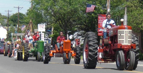 Gore Family in the Newtown Heritage Parade with the tractors they still use on the farm